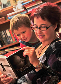Anne-marie Taplin at home with son George