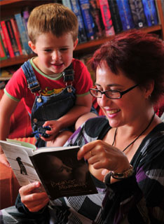 Anne-marie Taplin at home with son George