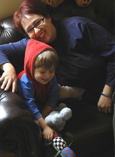 Anne-marie Taplin at home with son George