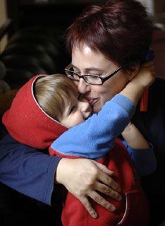 Anne-marie Taplin cuddling son George